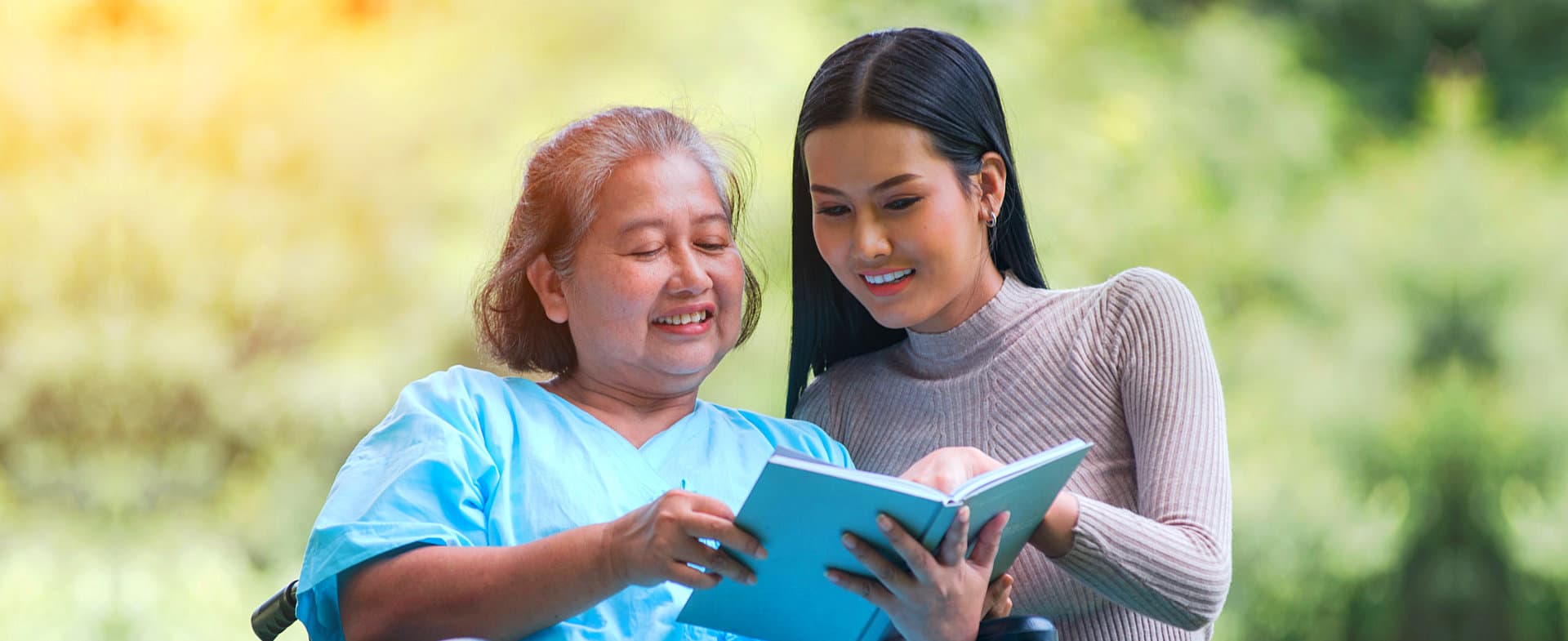 caregiver helping her patient while reading