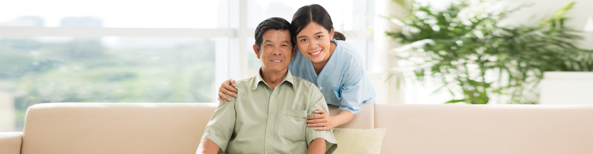 caregiver and patient smiling for the camera